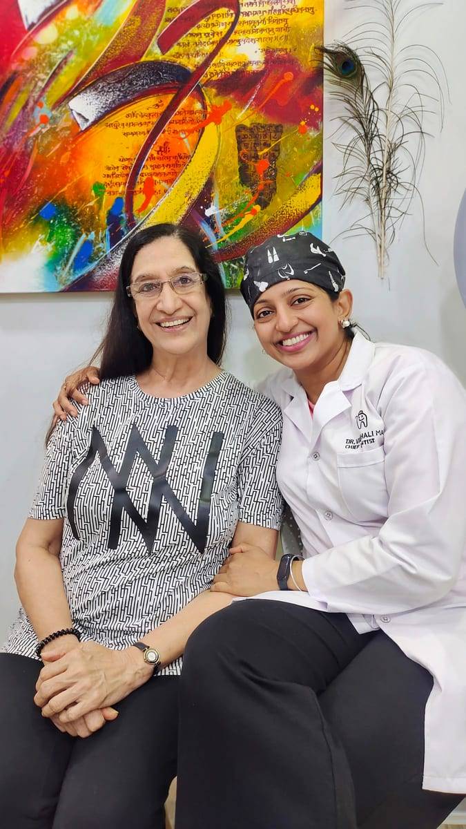 A smiling patient with Dr. Vaishali at Make Me Smile