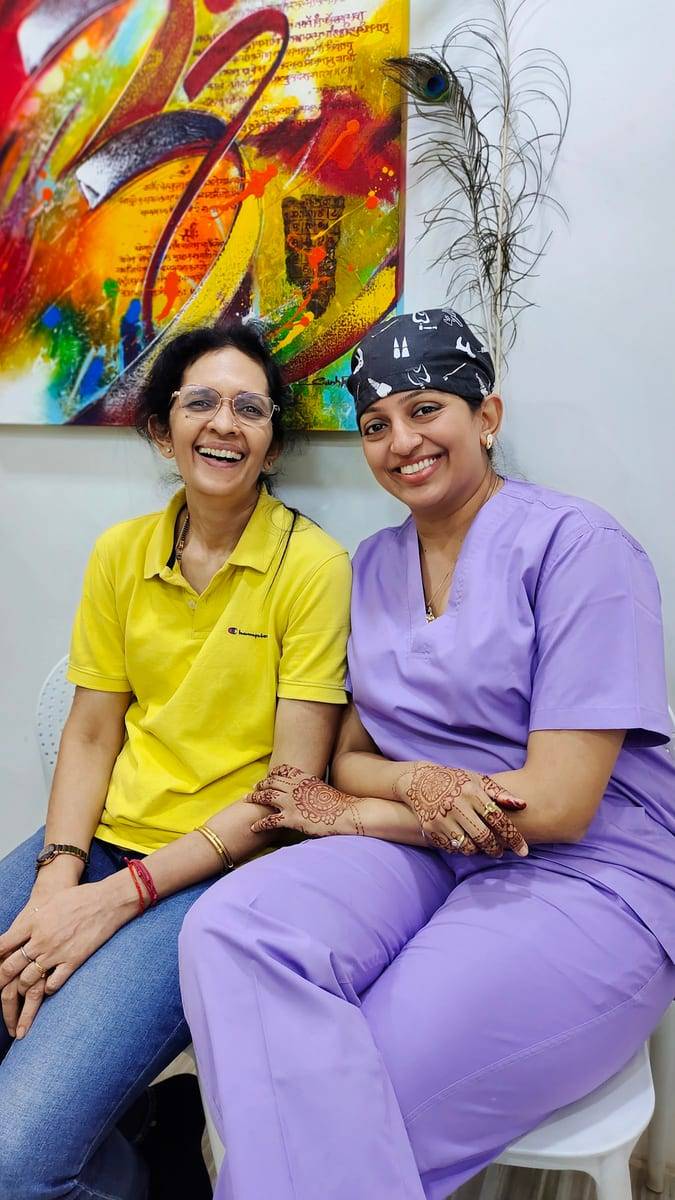 A smiling patient with Dr. Vaishali at Make Me Smile