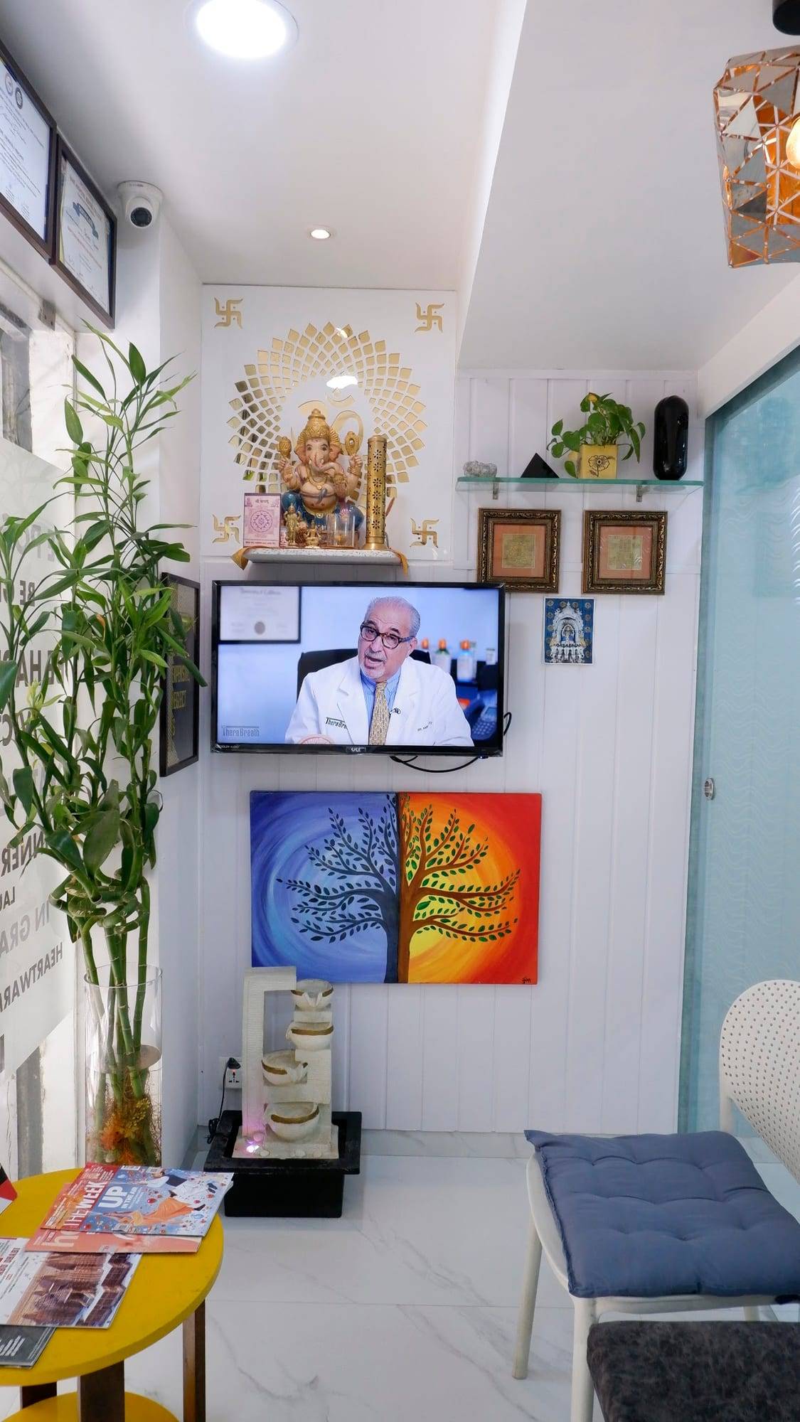Waiting area with a painting and plants